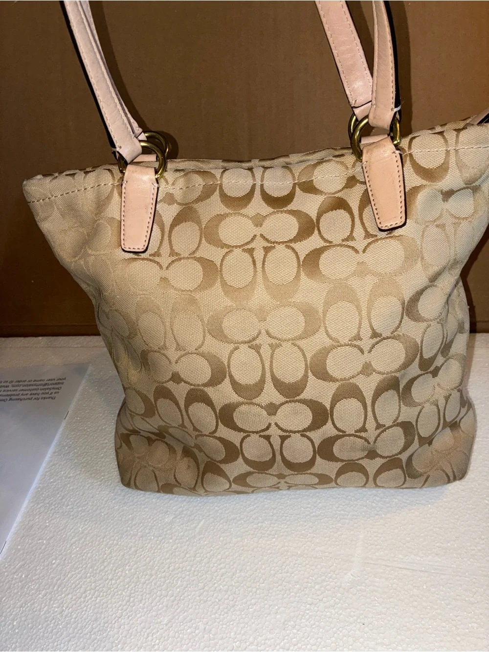 COACH Beige Signature Tote with Teal Center Stripe.